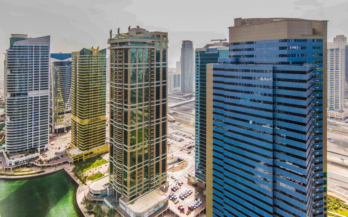 Jumeirah Lake Towers (JLT) has high rise towers by the lakeside in Dubai